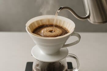 V60 cone over glass server, blooming stage