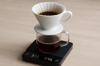 Coffee scale with dripper and cup on top